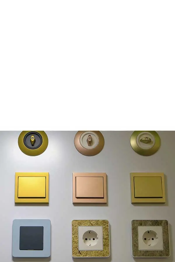 Verschiedene Schalterserien an einer Wand